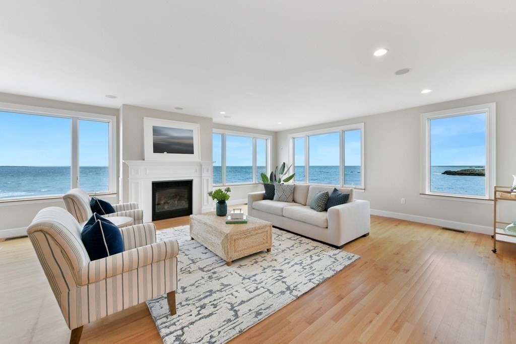 16 Burr Road Hull, MA 02045 - Photo 4 of 25 a living room with furniture and a fireplace