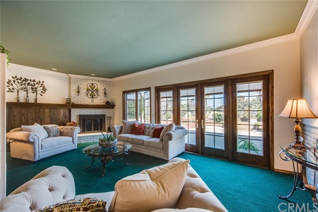 2001 Cypress Point Drive Corona, CA 92882 - Photo 21 of 62 Formal living room with French doors and cozy fireplace