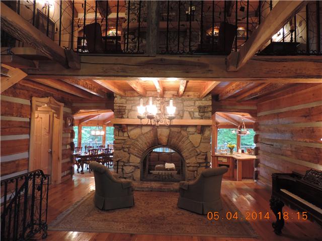 1020 West Sears Road Pegram, TN 37143 - Photo 10 of 14 Entry walking in through the front doors. The Central F.P. looks through to the Living area. The custom ivy handrail to the 2nd floor Library/Reading space with it's own cozy F.P which shares the flu with the main central F.P.