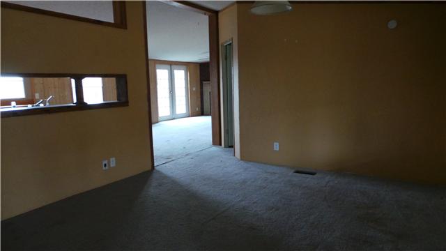 16 Jim Lyle Road Cumberland City, TN 37050 - Photo 12 of 12 Living room and kitchen view