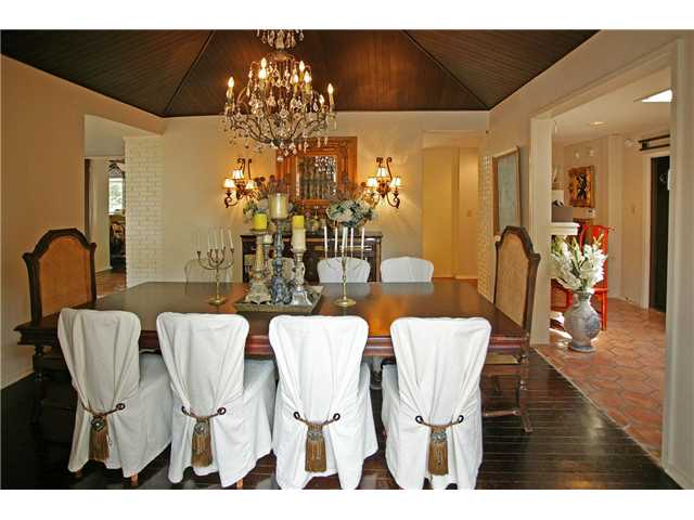 1992 Kirby Road Memphis, TN 38119 - Photo 9 of 24 The Dining Room features Hardwood Flooring and an Elegant Chandelier.