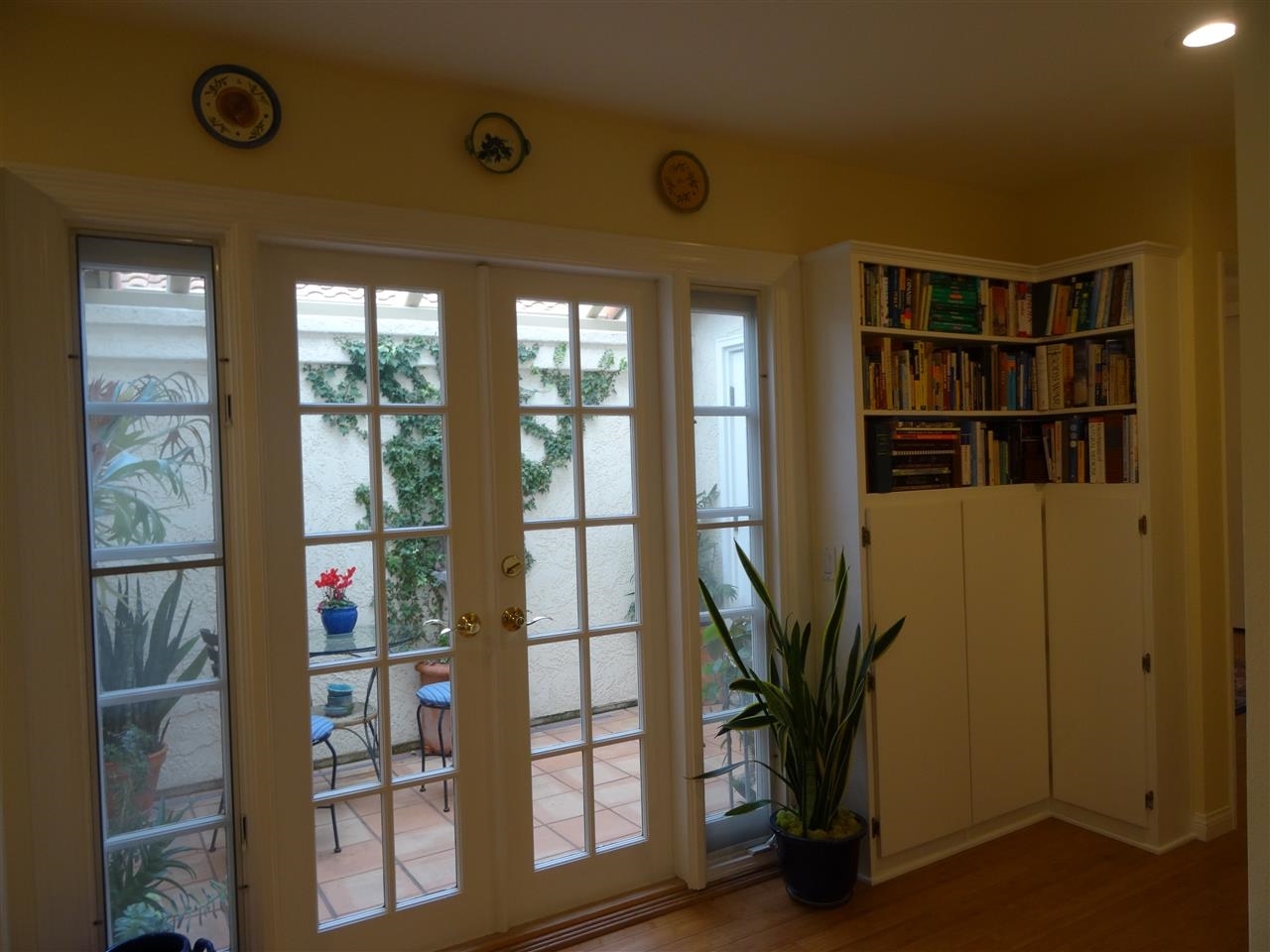 13312 Pantera Road San Diego, CA 92130 - Photo 13 of 25 French doors to private atrium with water feature.