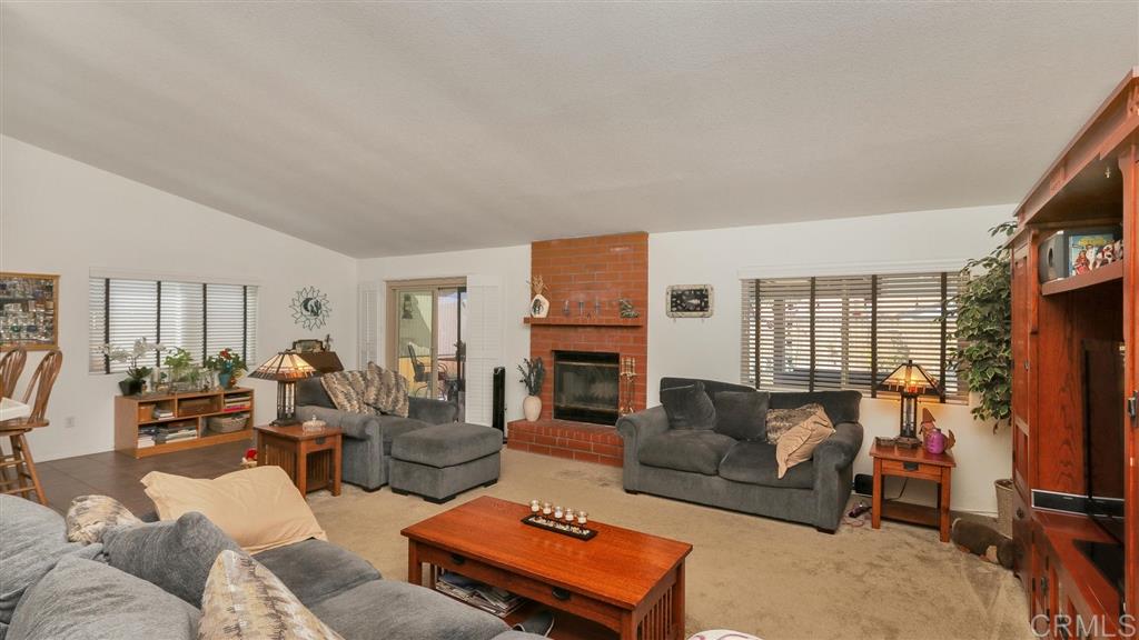 12834 Cochera Road Lakeside, CA 92040 - Photo 3 of 16 Cozy Fireplace and Energy Efficient Ceiling Fan
