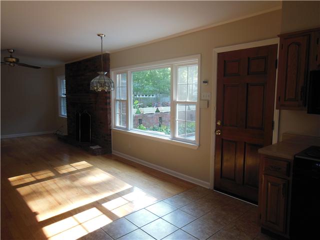 421 North Mendenhall Road Memphis, TN 38117 - Photo 14 of 25 keeping/hearth room off of kitchen with brick fireplace and big picture window