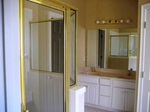 1742 Gosnold Bluff Road Collierville, TN 38017 - Photo 7 of 8 A separate large shower, a WC, double sinks, a walk in closet, and a whirlpool tub! This is FANTASTI