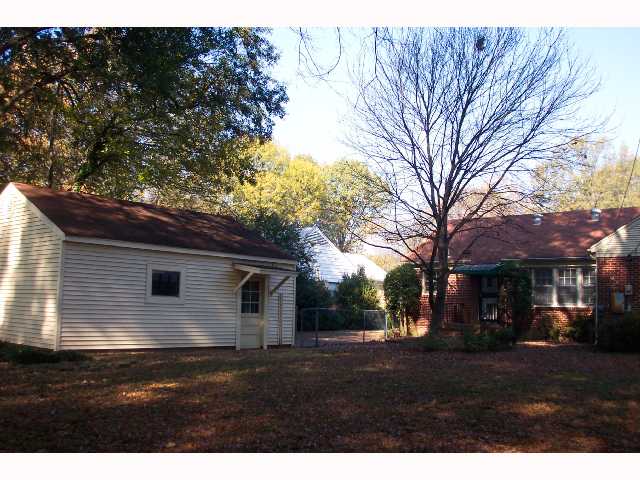 4813 Kaye Road Memphis, TN 38117 - Photo 10 of 10 Backyard looking towards house and extra large one car garage with work room.