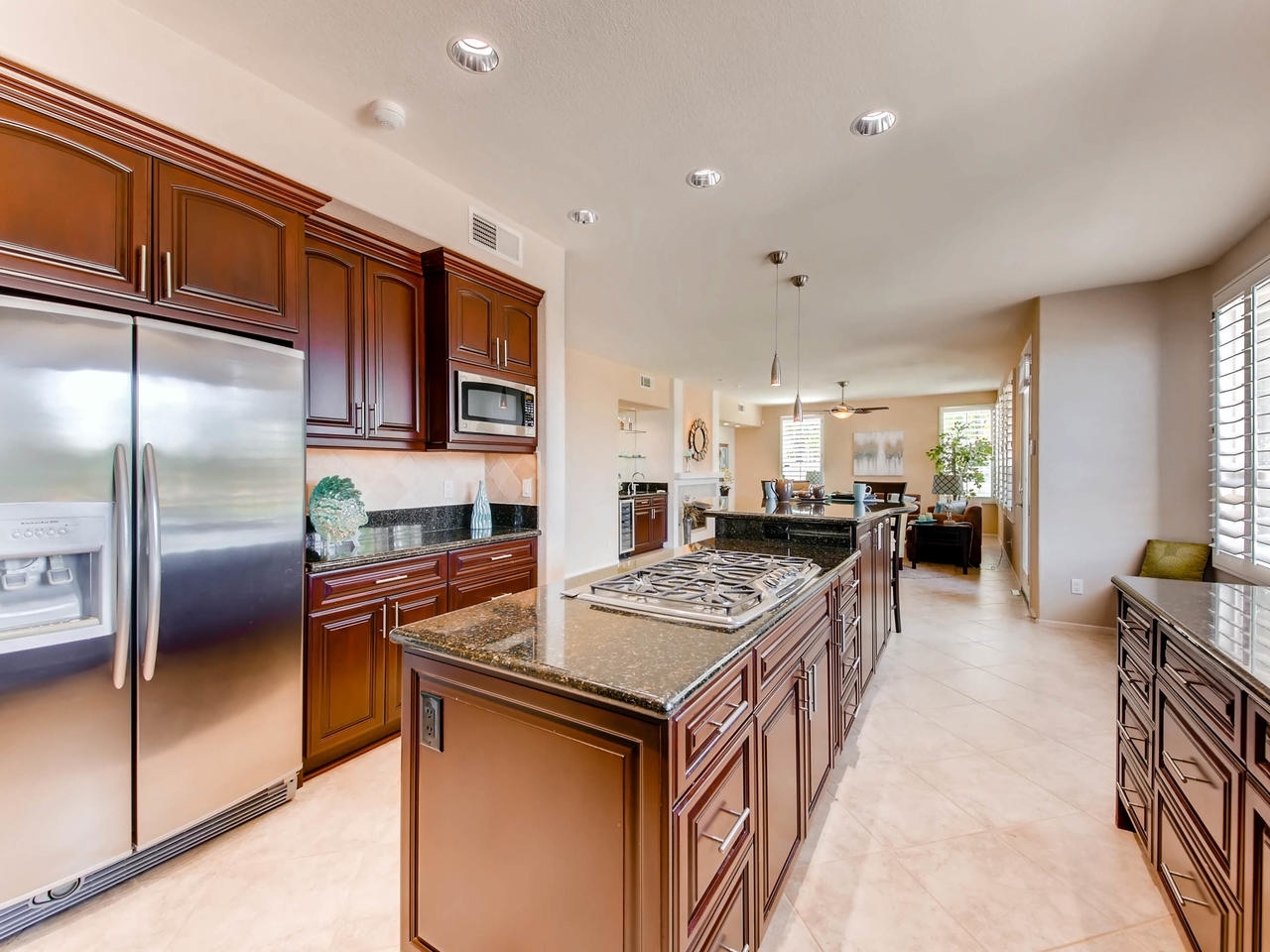 1657 Del Mar Road Oceanside, CA 92057 - Photo 8 of 19 Granite counters, large Granite Island SS appliances including built in fridge, double ovens with convection, warming drawer, 5 burner cook top, cherrywood custom cabinets featuring slow close, SS sink, reverse osmosis