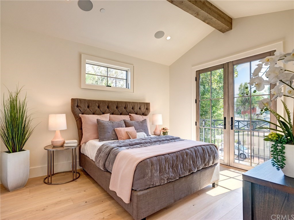 559 31st Street Manhattan Beach, CA 90266 - Photo 33 of 49 Upstairs bedroom suite #2 with Juliet balcony, Trestlewood accent wood beam, whole home surround sound.