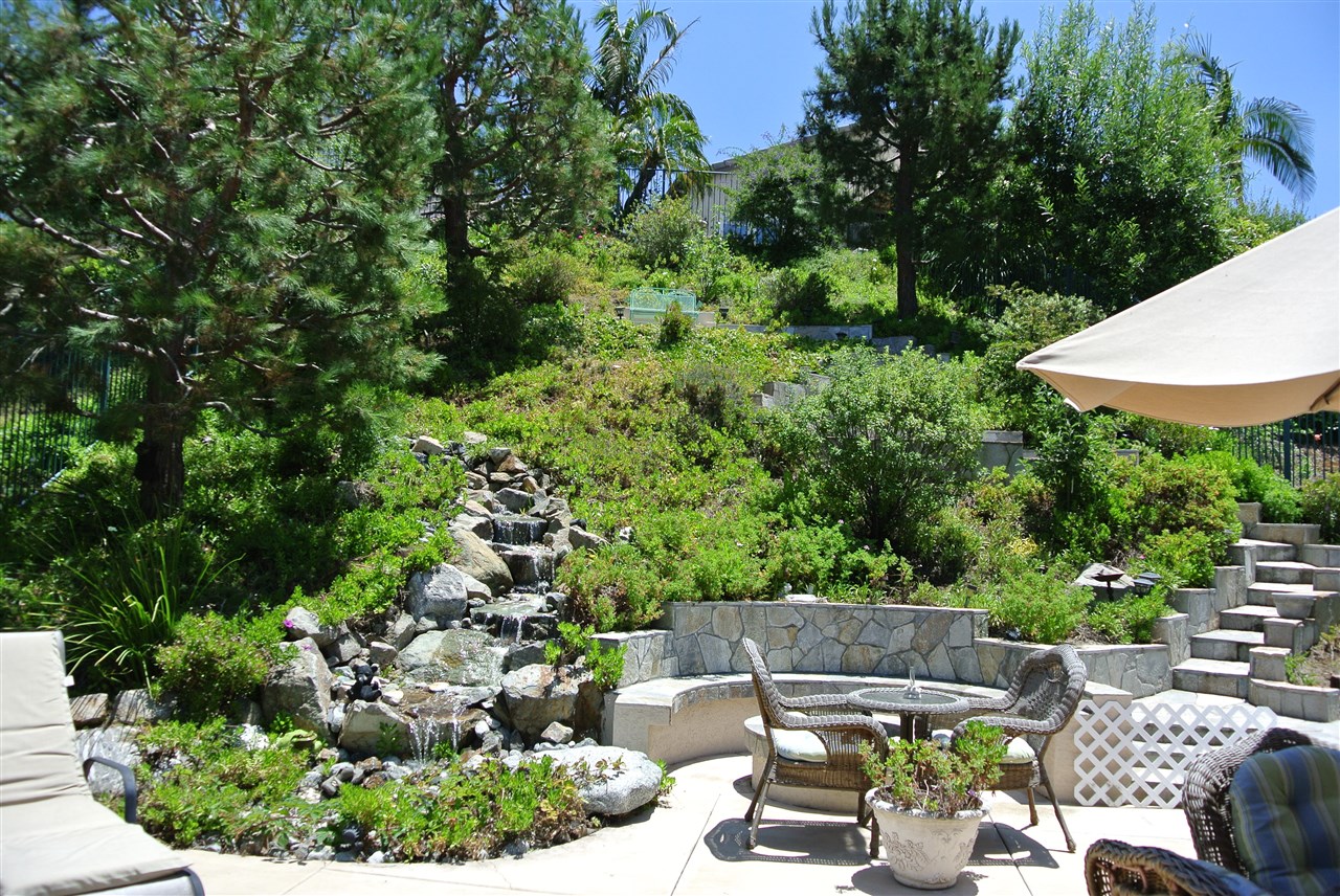 1255 Mariposa Road Carlsbad, CA 92011 - Photo 15 of 25 Backyard with fire-pit for lively conversations