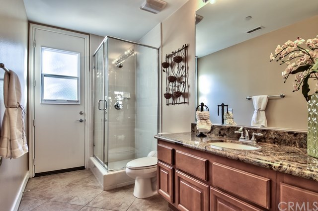 2148 Sageleaf Circle Corona, CA 92882 - Photo 39 of 74 The downstairs bathroom. It has a side door that leads to the side of the backyard.