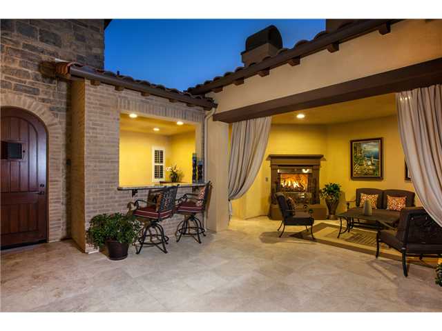 6989 Corte Langosta Carlsbad, CA 92009 - Photo 2 of 25 Imagine your guests being greeted by this stunning , private entry courtyard. Locking wooden gate allows no one uninvited to access your front door & home is prewired for cameras. Travertine floors dress this entire space all laid with no grout joints.