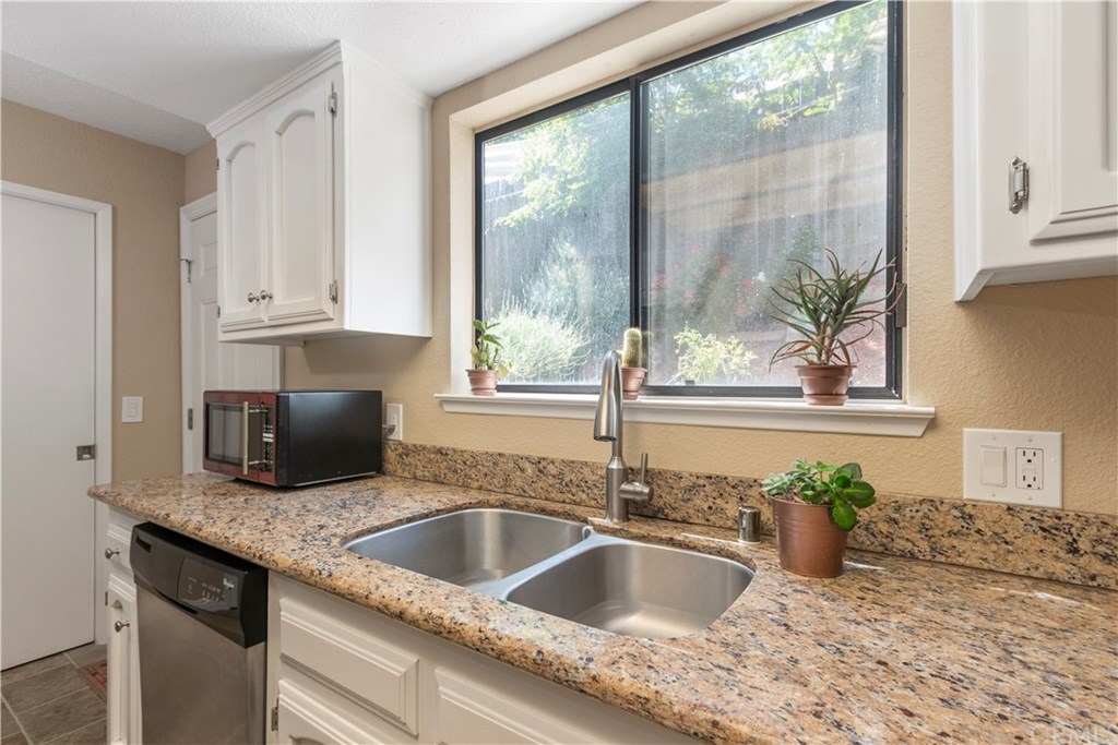 628 4th Street Paso Robles, CA 93446 - Photo 9 of 22 Granite counter tops and plenty of cabinets in the kitchen