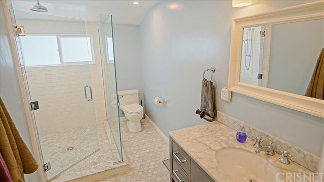 16809 Tupper Street Northridge, CA 91343 - Photo 12 of 19 First bathroom has lovely tile and glass with rain shower