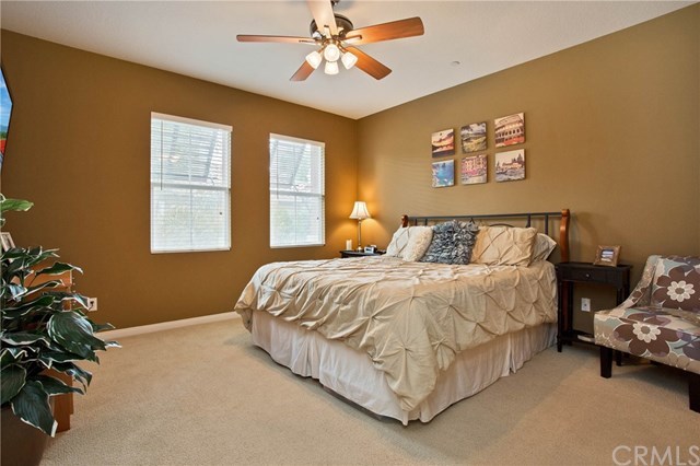 21 Corte Javier San Clemente, CA 92673 - Photo 15 of 30 The spacious master bedroom offers wood blinds, lighted ceiling fan and neutral toned carpeting.