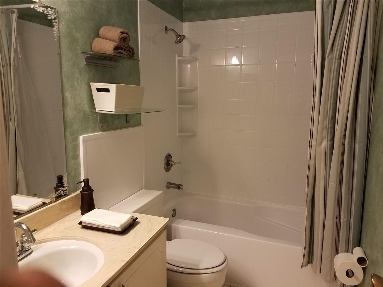 5718 Quince Road, Unit 3 Memphis, TN 38119 - Photo 18 of 21 The upstairs hall bath offers brand new bathtub and tile surround.