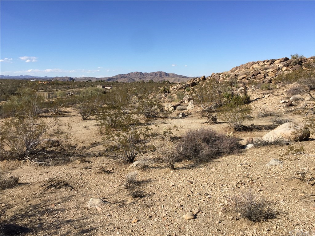 8140 Skyline Drive Joshua Tree, CA 92252 - Photo 16 of 27 The view is fantastic from the center of this five acres in Monument Manor. Unlimited vistas with privacy in the rocks and access from paved Quail Springs Road.