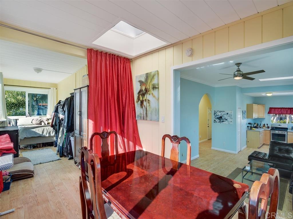 869 Beryl Street San Diego, CA 92109 - Photo 7 of 25 A 17 x 6.6 ft space is adjacent to the dining room, with a private deck. Perfect for home office, extra sleeping quarters, or a enjoying the natural light and ocean breezes.