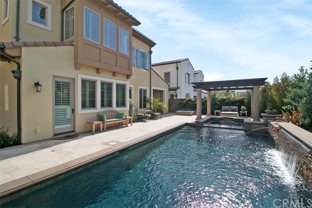 17 Rawhide Irvine, CA 92602 - Photo 32 of 56 Top of the line salt water pool features large waterfall, LED lights, connected jacuzzi spa covered by outdoor structure. High end equipment (Pentair and Jandy) with mobile app control of pool features. Cost of private luxury is kept low with 12-panel 3.7 kilowatt solar power ($125 average electric bill including heating and use of pool features).