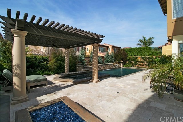 17 Rawhide Irvine, CA 92602 - Photo 30 of 56 Top of the line salt water pool features large waterfall, LED lights, connected jacuzzi spa covered by outdoor structure. High end equipment (Pentair and Jandy) with mobile app control of pool features. Cost of private luxury is kept low with 12-panel 3.7 kilowatt solar power ($125 average electric bill including heating and use of pool features).