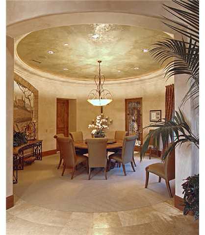 6890 St Andrews Road Rancho Santa Fe, CA 92067 - Photo 7 of 15 A very unique curvilenear dining room with specila lighting.