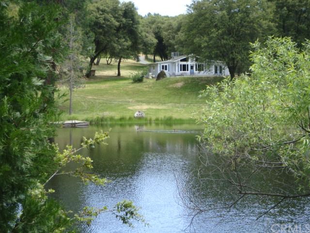 5699-5705 Darrah Road Mariposa, CA 95338 - Photo 1 of 1 MAIN HOUSE VIEW FROM ACROSS LAKE