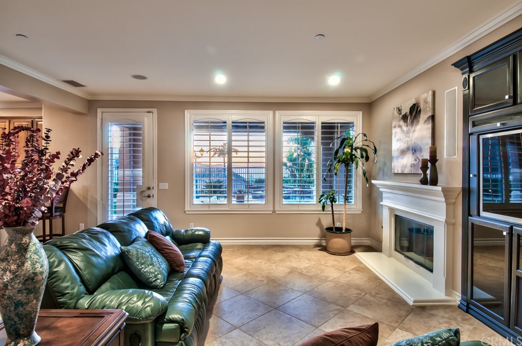 2148 Sageleaf Circle Corona, CA 92882 - Photo 14 of 74 This is another angle of the family room. The diagonally laid tile floors expand into the lower halls, the kitchen and, downstairs bath and the laundry room.