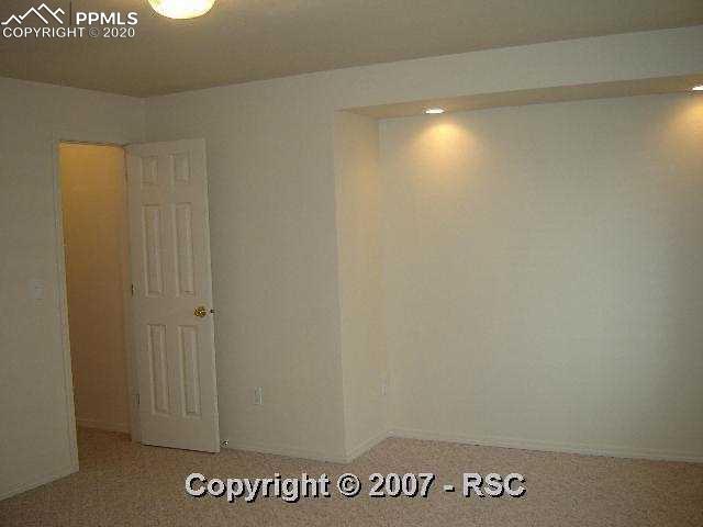 8096 Oliver Road Falcon, CO 80831 - Photo 14 of 16 Large Basement Bedroom or Theater Room With Recess Lighting and Walk-in-closet