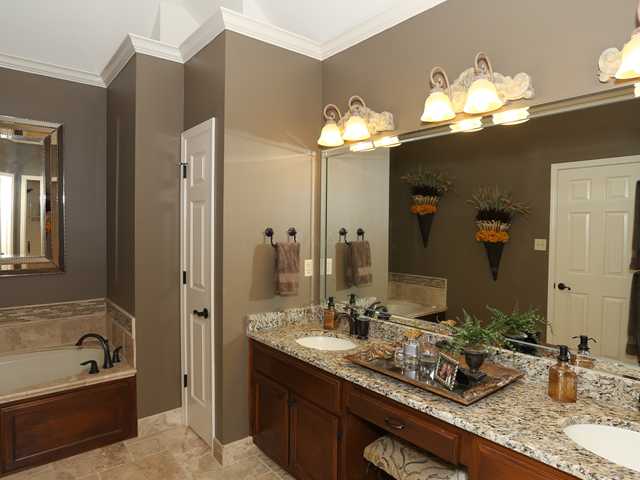 901 Yorktown Road Collierville, TN 38017 - Photo 12 of 21 Lavish Master Bath with new granite tops and under mount DOUBLE SINKS, new natural stone flooring, new oil rubbed bronze fixtures, new light fixtures. Lady of the house: note sit down vanity!