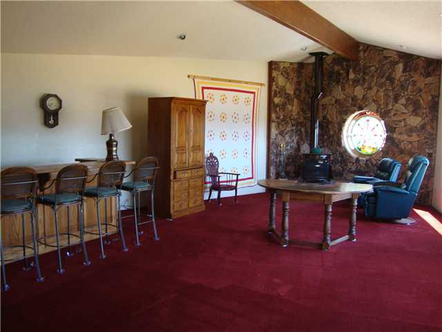 34419 Engineers Road Julian, CA 92036 - Photo 8 of 17 Family room with large wet bar and wood burning stove also fabulous views