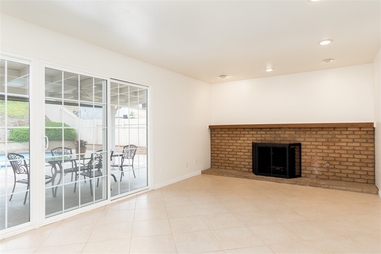 10312 Molino Road Santee, CA 92071 - Photo 11 of 25 Family room has lovely fireplace with a gas starter. Real brick and wonderful mantel. This room could also be a large dining room.