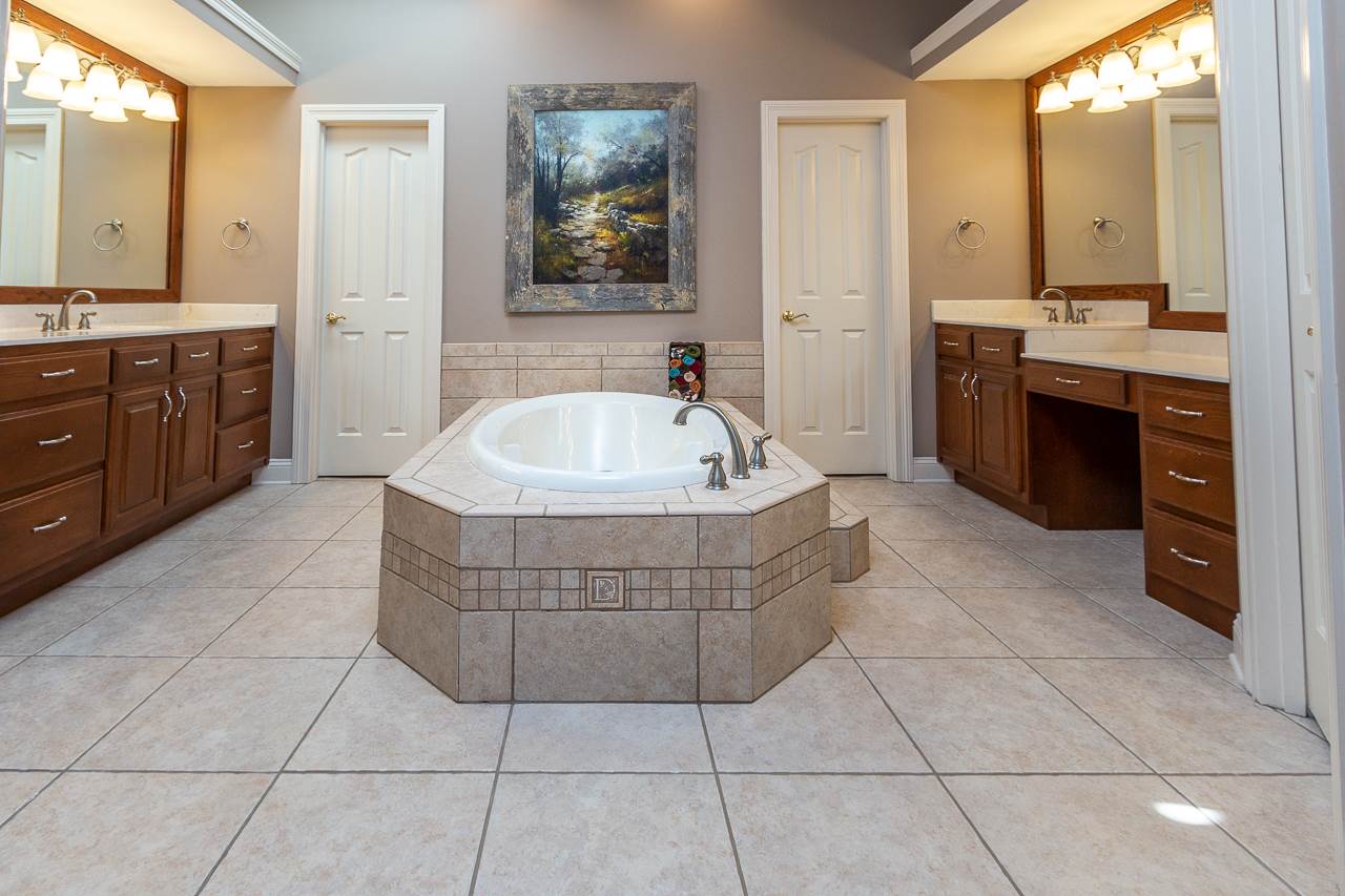 2245 Burnett Road Williston, TN 38076 - Photo 14 of 25 There is a huge walk-in closet along with double vanities and larger than usual shower.