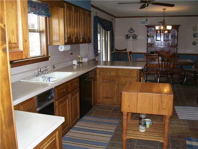 8979 Tracy Road Atoka, TN 38004 - Photo 4 of 12 Another view of the kitchen, opens to dining area