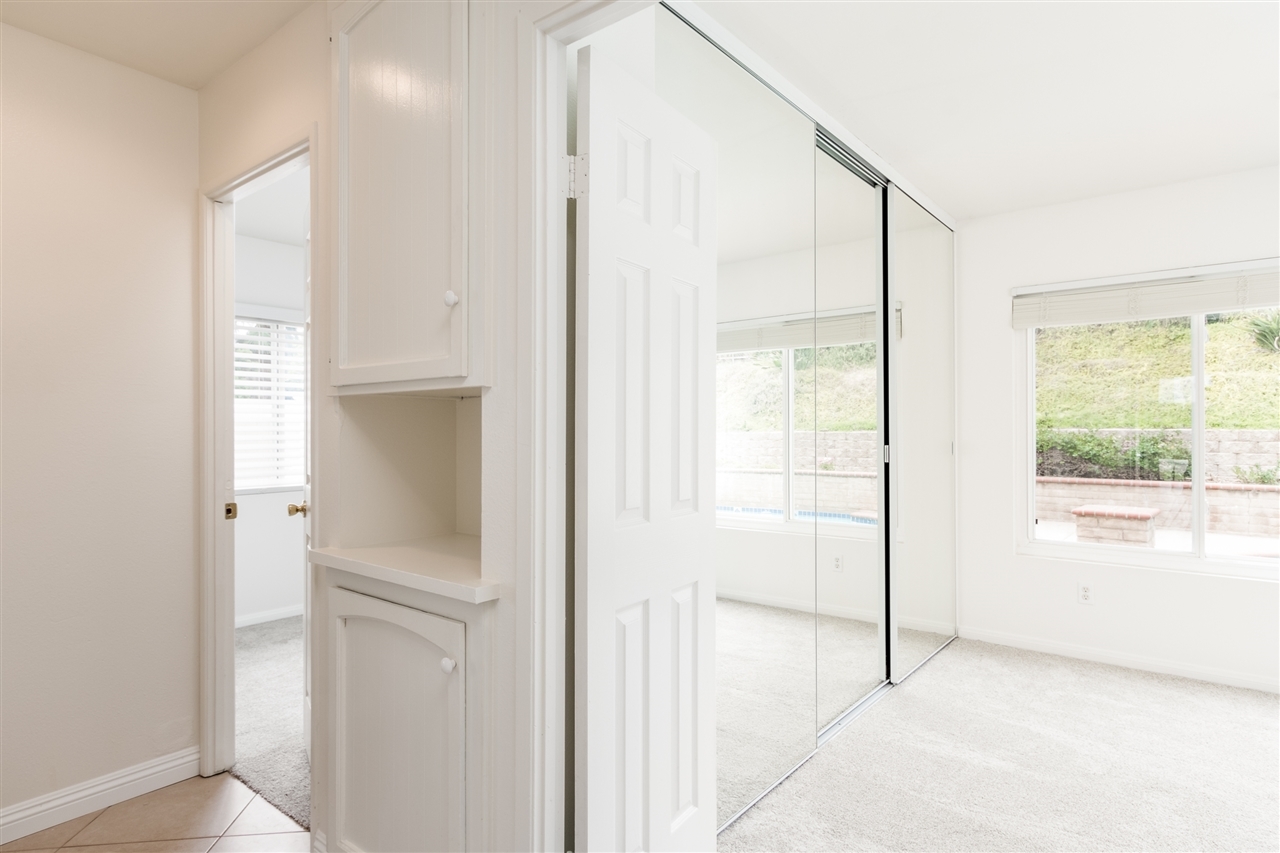 10312 Molino Road Santee, CA 92071 - Photo 13 of 25 In hall showing entrance to bedrooms and linen storage.