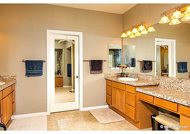 17173 Ralphs Ranch Road San Diego, CA 92127 - Photo 13 of 16 The walk-in closet is framed by the his and her sinks.