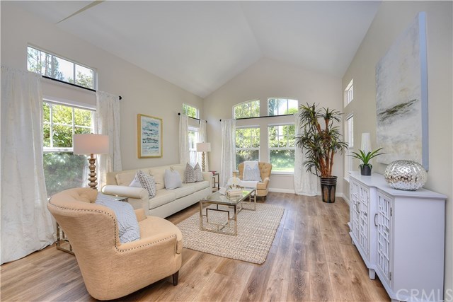 7 Wickford Lane Ladera Ranch, CA 92694 - Photo 11 of 36 Living room with vaulted ceilings and open to dining room
