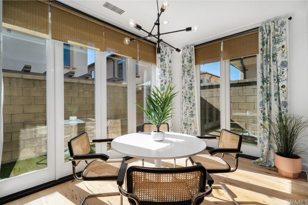 116 Mosswood Irvine, CA 92620 - Photo 13 of 42 The added conservatory room features floor-to-ceiling windows. This bright space can cater to whichever function you desire.