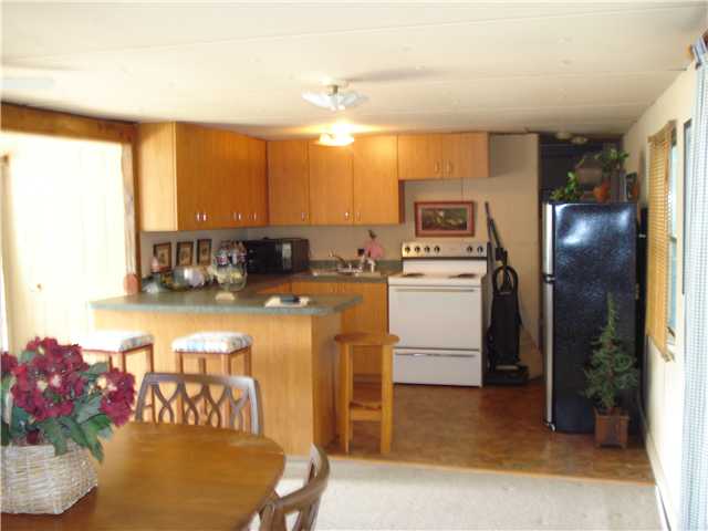 98 Chisholm Lake Spur Road Ripley, TN 38063 - Photo 4 of 9 cozy kitchen open to all areas and great views of the water!