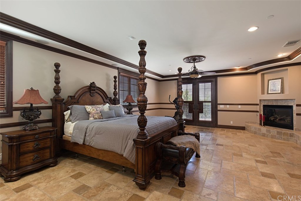 1640 Hillside Avenue Norco, CA 92860 - Photo 39 of 75 Main master bedroom with fireplace and French doors to patio