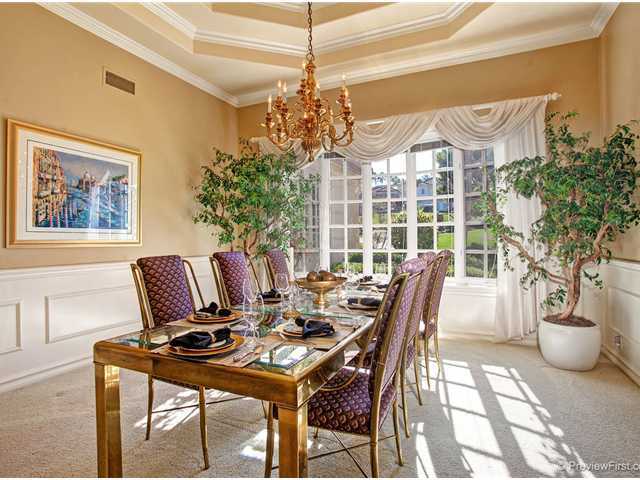 17036 Circa Del Sur Rancho Santa Fe, CA 92067 - Photo 3 of 25 The formal dining room is decorator perfect with an intricate tray ceiling, wainscoting, and custom finishes.
