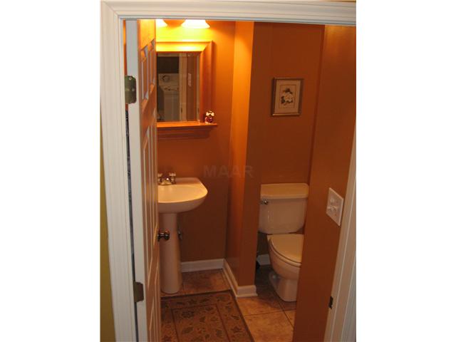 935 Fite Road Millington, TN 38053 - Photo 19 of 25 Enter this full bath from the laundryrm. The bath features glass shower doors, built-in linen shelves & pedestal sink.