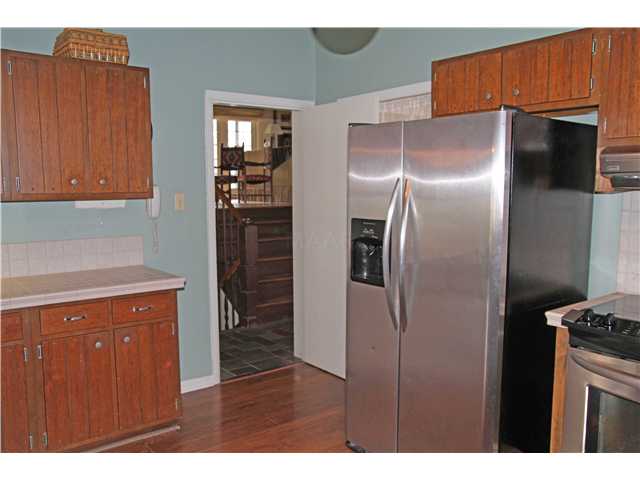 7685 Stout Road Germantown, TN 38138 - Photo 8 of 21 Another view of the kitchen shows the stainless appliances and the slated floor in the entry hall