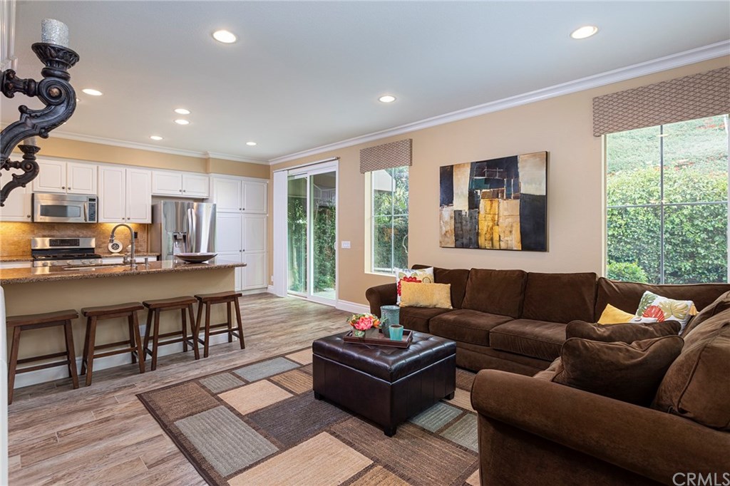Great room style layout with breakfast bar, family room, kitchen and nook area