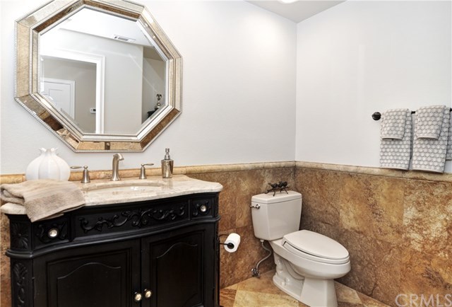 7 Estates Drive Villa Park, CA 92861 - Photo 28 of 46 Half bath stone floors and walls and custom vanity.