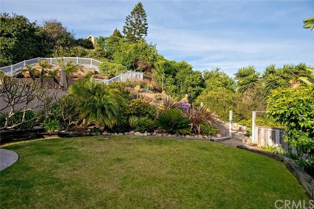 34096 El Contento Dana Point, CA 92629 - Photo 29 of 43 Truly a rare and amazing opportunity to own a quintessential Lantern Village beach bungalow situated atop one of the largest LOTS in the area with OCEAN and Whitewater vistas!