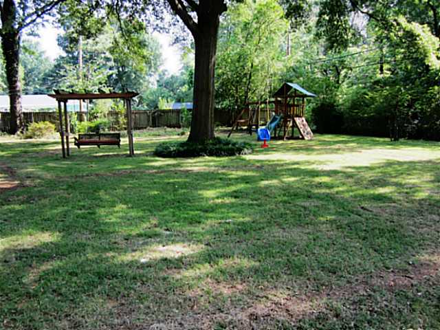 229 South Mendenhall Road Memphis, TN 38117 - Photo 23 of 25 Just a partial view of great backyard for family enjoyment! New wood fence encloses almost 1/2 acre backyard!