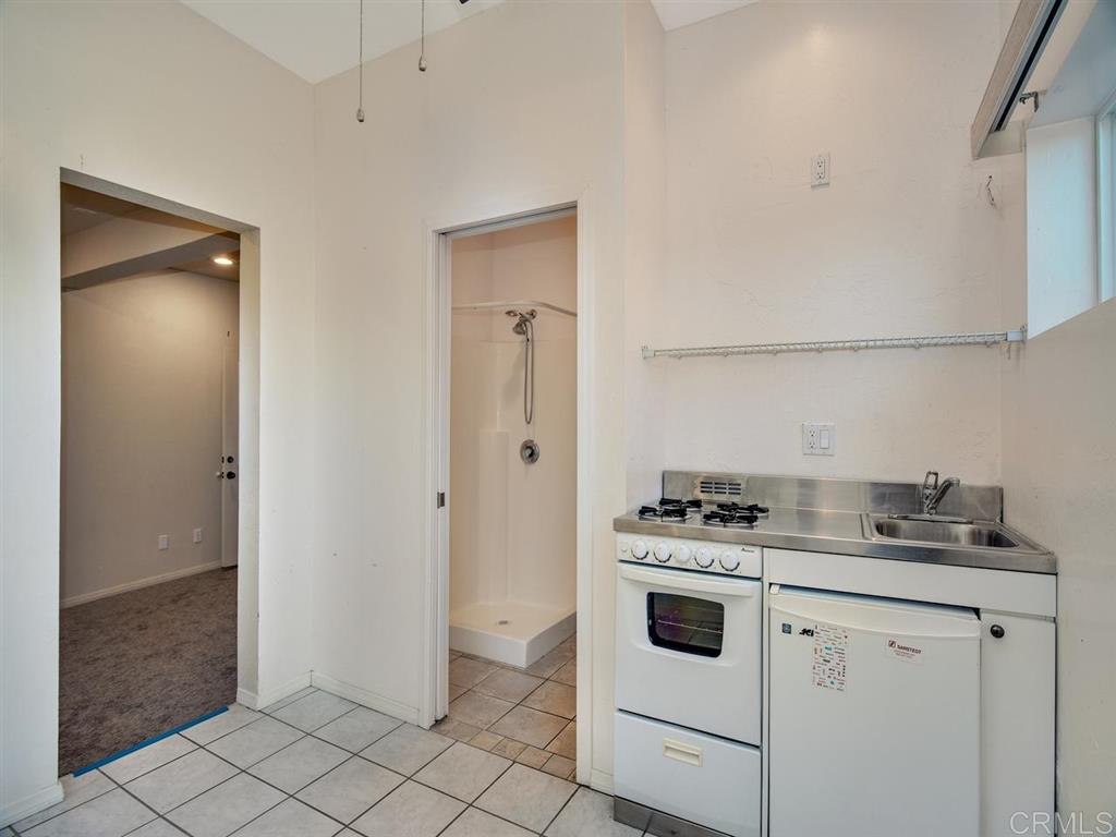 869 Beryl Street San Diego, CA 92109 - Photo 20 of 25 One bay of the 3 car garage is currently used as bonus space with a removable kitchenette and 3/4 bath