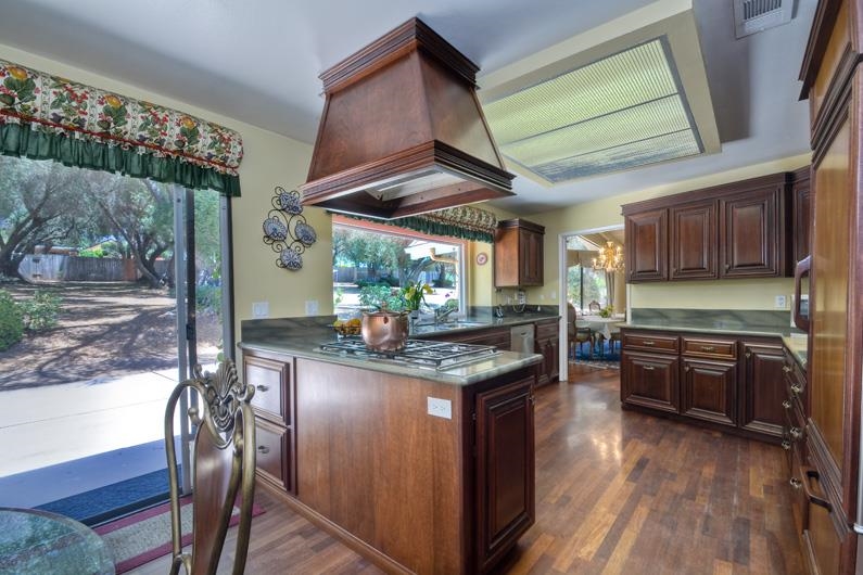 28363 Shady Knoll Road Valley Center, CA 92082 - Photo 10 of 25 Another angle of kitchen with stove and center island that separate main kitchen from the breakfast area...