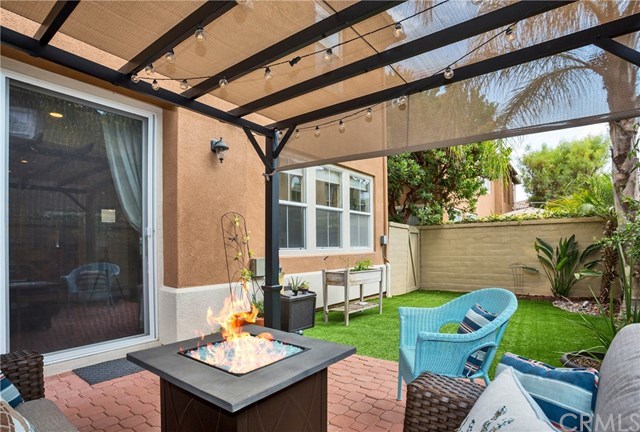 21 Corte Javier San Clemente, CA 92673 - Photo 13 of 30 The rest of the yard has been delightfully finished with artificial turf, palms and other lovely landscaping.