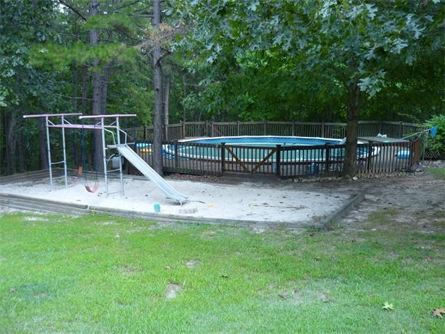 157 Indian Creek Road Hohenwald, TN 38462 - Photo 16 of 16 Above ground pool and playground in back yard