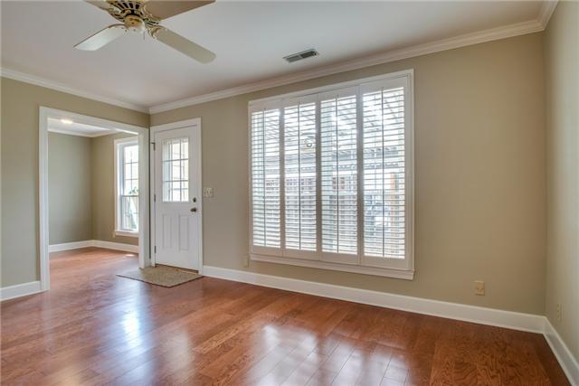 965 General George Patton Road, Unit 965 Nashville, TN 37221 - Photo 1 of 10 Another view of the Den showing access to the private covered outdoor patio and kitchen area. All hardwood and plantation shutters.